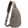 Sac bandoulière 18 x 8 x 32 cm en tissu synthétique taupe à compartiments zippés